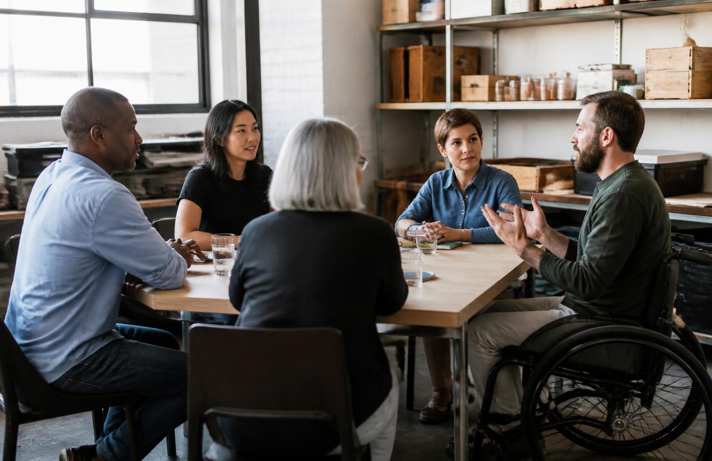A small business team meeting around a table to plan their week